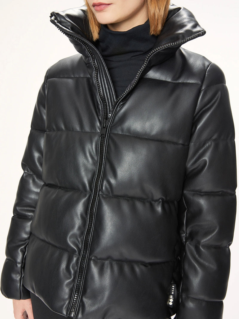 Woman wearing a black puffer jacket.