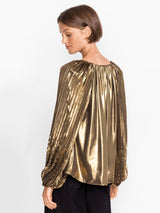 Woman wearing the Golden Gem Pleated Blouse by Johnny Was.