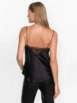 Woman wearing the black Skye Silk Cami by Johnny Was.