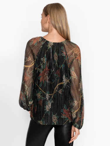 Woman wearing the Evelina Metallic Blouse by Johnny Was.