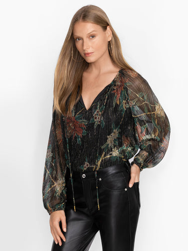 Woman wearing the Evelina Metallic Blouse by Johnny Was.