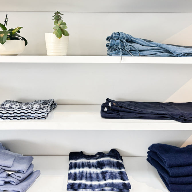 Close up of a clothing-lined shelf at a Margaret O'Leary store.