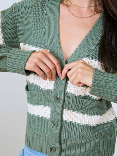 Woman wearing the Barrel Sleeve Cardi by Margaret O'Leary.