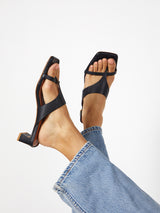 Woman wearing the Flume Heel in Black by Intentionally Blank.