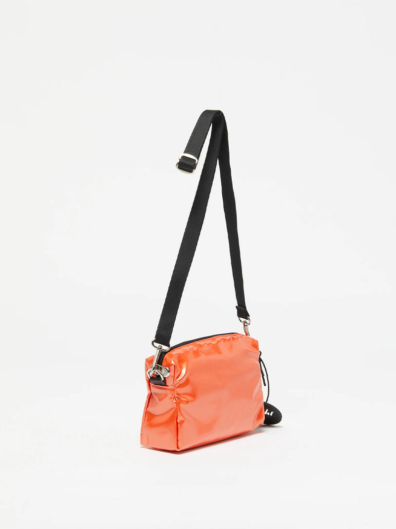 The Mini Light Shoulder Bag in Orange by Jack Gomme.