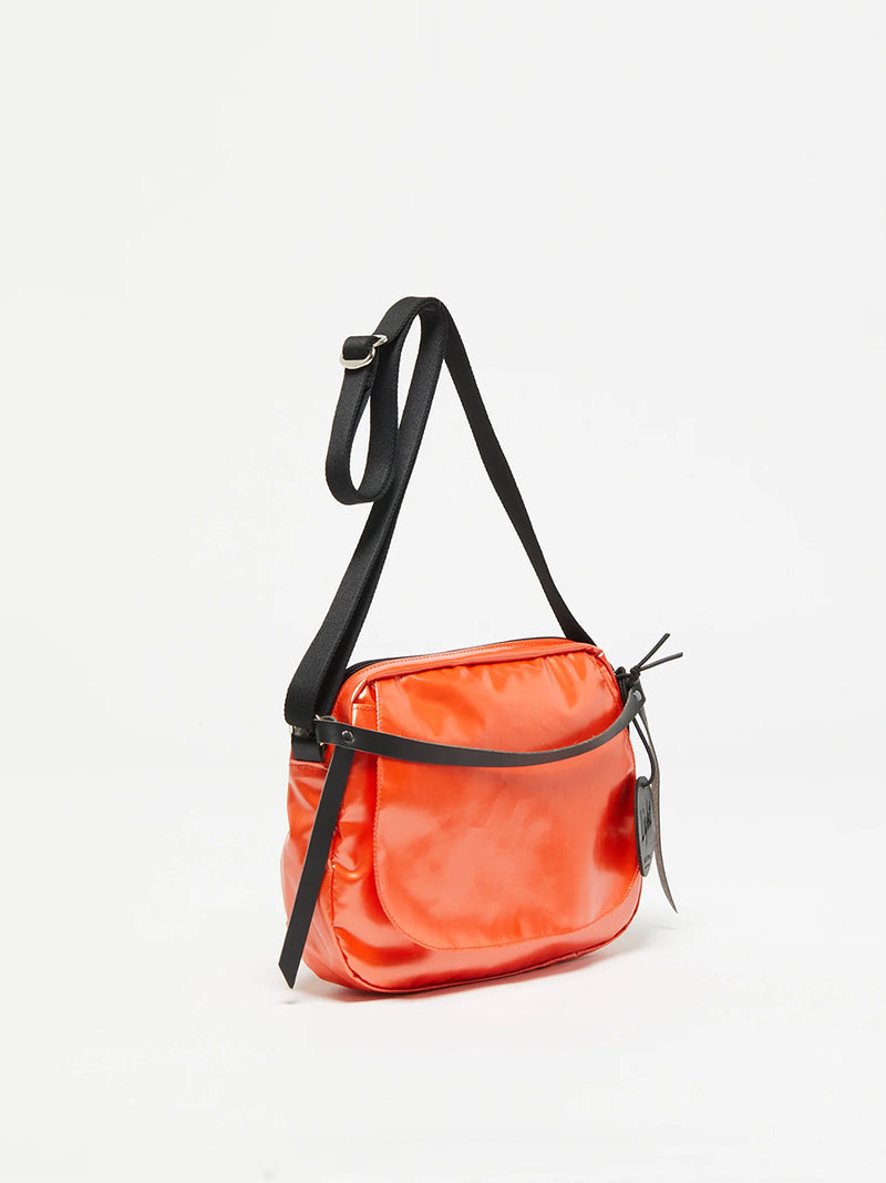 The Happy Light Shoulder Bag in Orange by Jack Gomme.