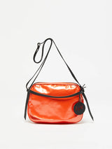 The Happy Light Shoulder Bag in Orange by Jack Gomme.