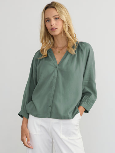 Woman wearing the Aerin Raglan Top by Margaret O'Leary.
