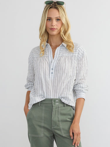 Woman wearing the Marina Popover Shirt by Margaret O'Leary.