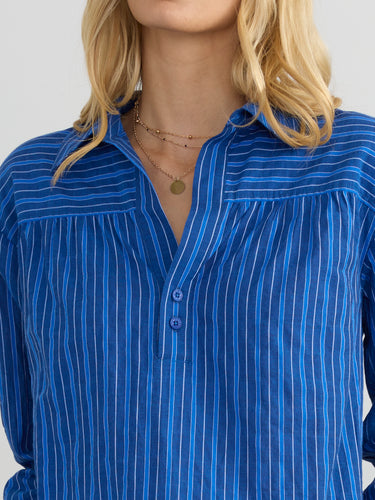Woman wearing the Marina Popover Shirt by Margaret O'Leary.
