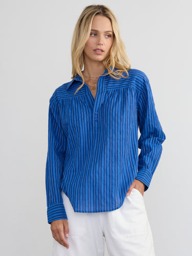 Woman wearing the Marina Popover Shirt by Margaret O'Leary.