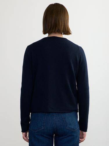Woman wearing the Cashmere Vee Cardigan by Margaret O'Leary.