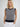 Woman wearing the Caroline Vest by Margaret O'Leary.
