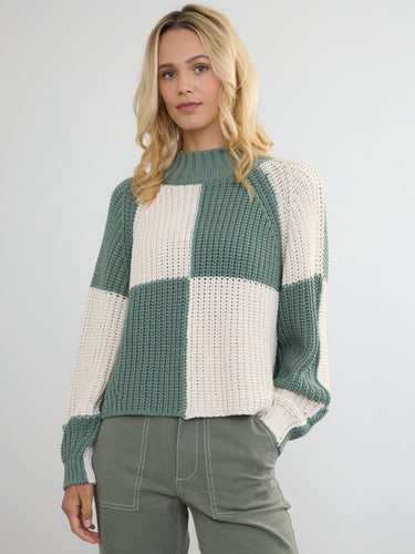 Woman wearing the Chessboard Pullover by Margaret O'Leary.