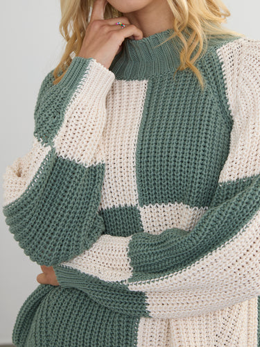 Woman wearing the Chessboard Pullover by Margaret O'Leary.
