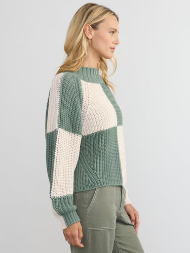 Woman wearing the Chessboard Pullover by Margaret O'Leary.