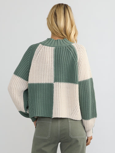 Woman wearing the Chessboard Pullover by Margaret O'Leary.