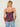 Woman wearing a Lace Silk Cami by Margaret O’Leary, a plum silk camisole with lace trim on a plain background.