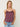 Woman wearing a Lace Silk Cami by Margaret O’Leary, a plum silk camisole with lace trim on a plain background.