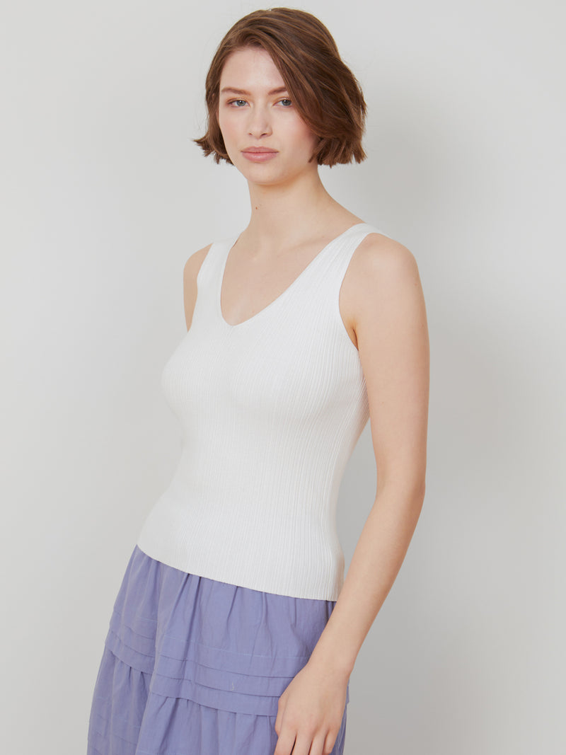Woman wearing the Selena Rib Tank in Ivory by Margaret O'Leary.