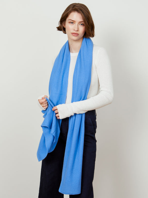 Woman wearing a cashmere travel wrap in coast by Margaret O'Leary.