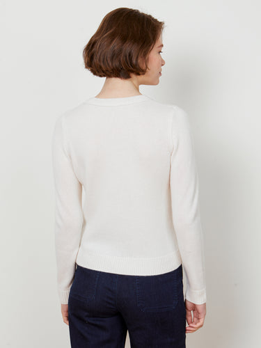 Woman wearing the cashmere pullover in ivory by Margaret O'Leary.