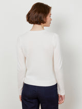 Woman wearing the cashmere pullover in ivory by Margaret O'Leary.
