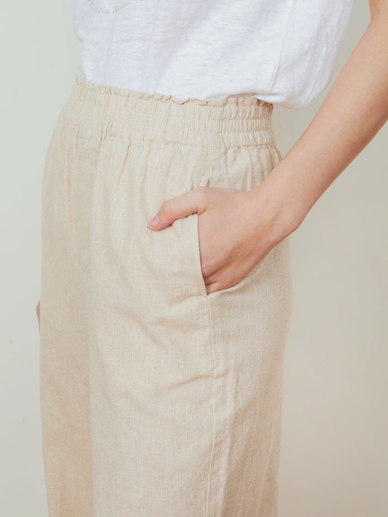 Woman wearing the Lilou Wide Leg Pant in Natural by Margaret O'Leary.