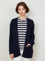 Woman wearing the Nina Cable Cardi in Navy by Margaret O'Leary.