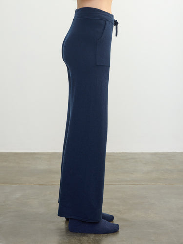 Person wearing the Cashmere Sweats, a blue cashmere sweat pant by Margaret O'Leary