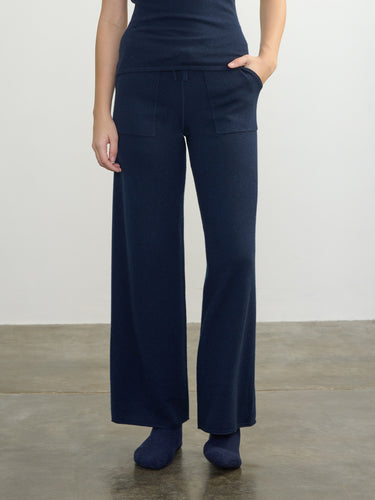 Person wearing the Cashmere Sweats, a blue cashmere sweat pant by Margaret O'Leary