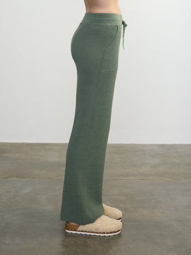 Person wearing the Joan Waffle Pant, a green waffle knit pant by Margaret O'Leary.