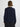 Person wearing the Lola Pullover, a blue and black boucle pullover by Margaret O'Leary paired with a black pleated skirt.