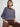 Person wearing the Lola Pullover, a blue and brown boucle pullover by Margaret O'Leary paired with brown pants.