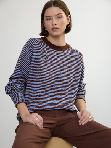 Person wearing the Lola Pullover, a blue and brown boucle pullover by Margaret O'Leary paired with brown pants.