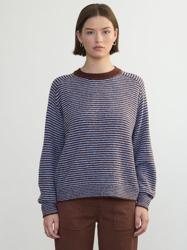 Person wearing the Lola Pullover, a blue and brown boucle pullover by Margaret O'Leary paired with brown pants.