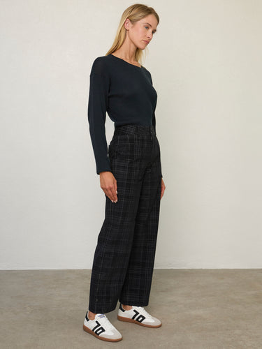 Person wearing the Parker Pant, a black corduroy plaid pant by Margaret O'Leary.