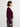 Person wearing The Rolled Sleeve Crew, a burgundy cashmere silk sweater by Margaret O'Leary and gray plaid pants on a white background