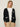 Person wearing the Santa Rosa Cardi a black cardigan with white accents by Margaret O'Leary paired with khaki pants