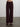 Person wearing The Trish Wide Leg Pant, a dark burgundy high-waisted pants by Margaret O'Leary on a plain background