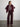 Woman wearing The Shiv Shirt a floral blouse by Margaret O'Leary, burgundy sweater, and pants against a plain background