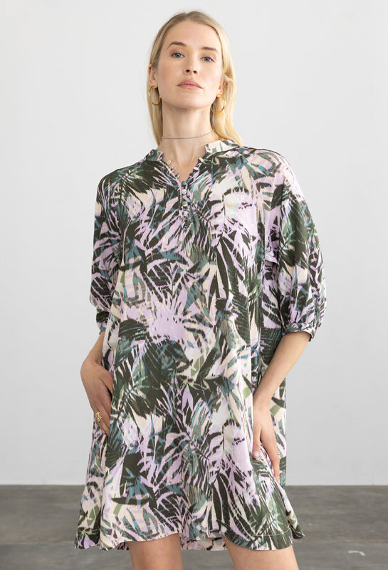 Woman wearing the Paola Dress in Dark Tropical by Margaret O'Leary.
