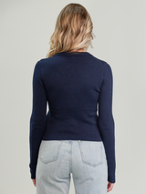 Woman wearing the Anya Rib Cardi in Navy by Margaret O'Leary.