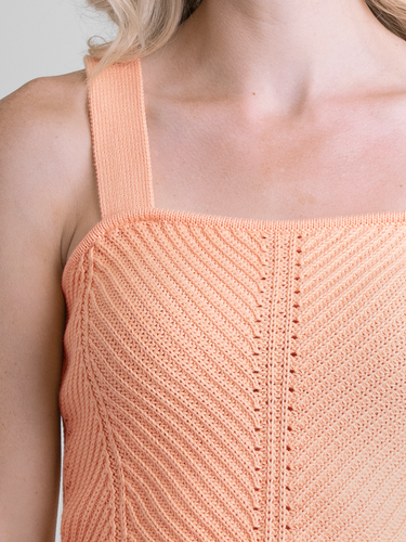 Woman wearing the Tia Knit Cami in Apricot by Margaret O'Leary.