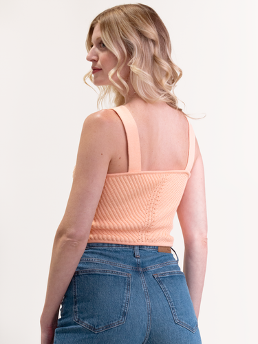 Woman wearing the Tia Knit Cami in Apricot by Margaret O'Leary.