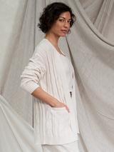 Woman wearing the Nina Cable Cardi in Ivory by Margaret O'Leary.