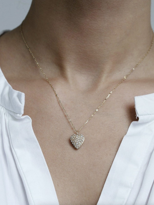 14 karat gold necklace and delicate freshwater pearls heart-shaped pendant.