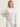 Woman wearing the Bella Boatneck in Sky by Margaret O'Leary.