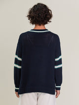 Woman wearing the Tennis Vee in Navy Mix by Margaret O'Leary.
