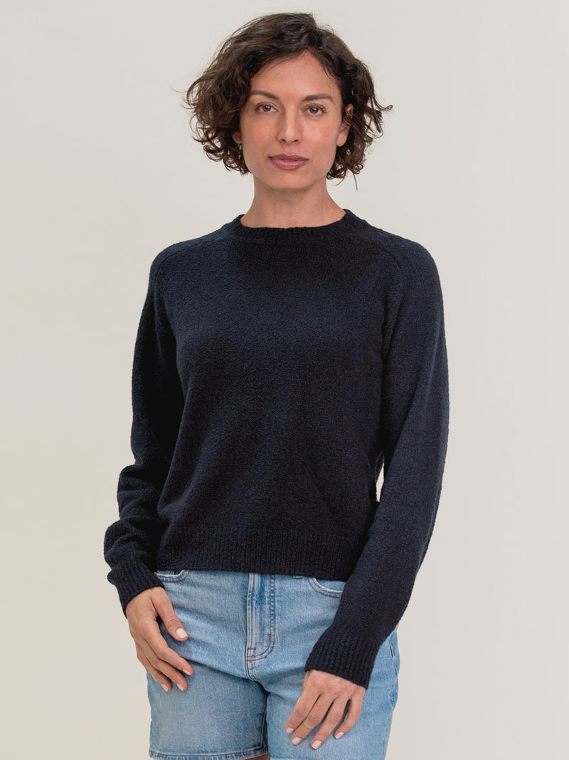 Woman wearing the Lola Pullover in Navy by Margaret O'Leary.